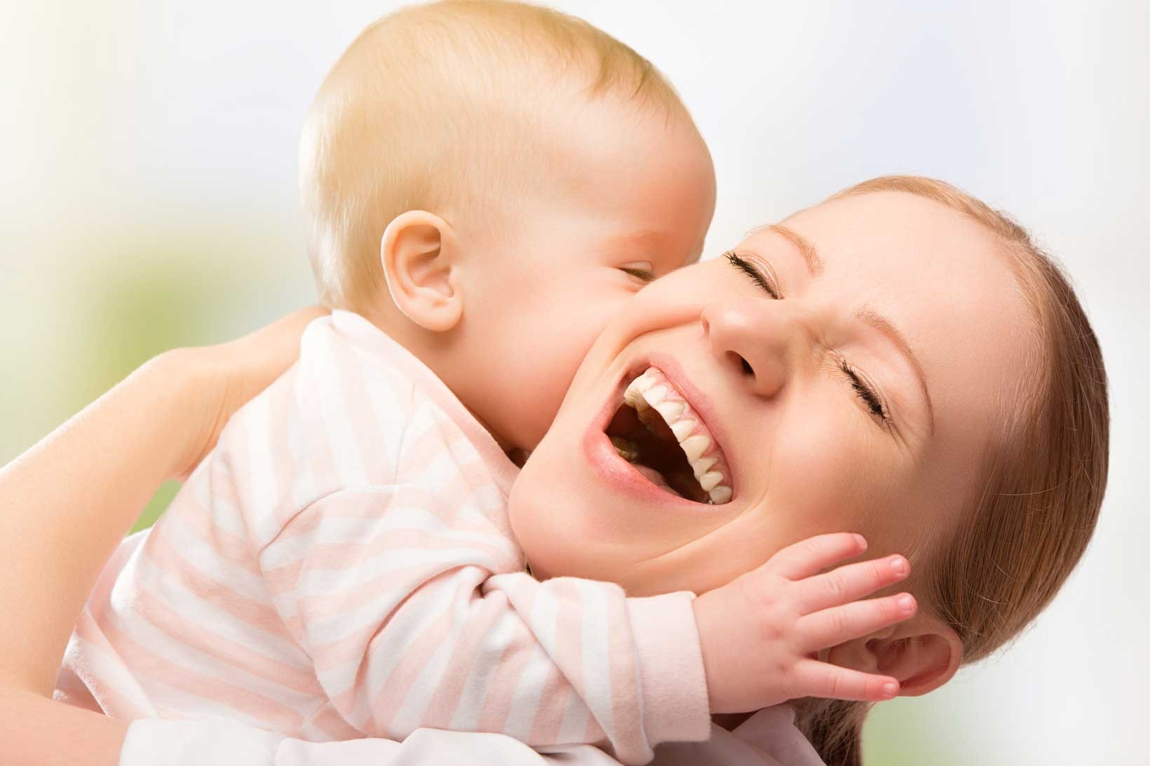 laughing mother and child