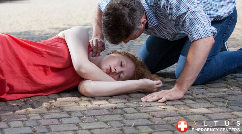 fainted woman on the ground