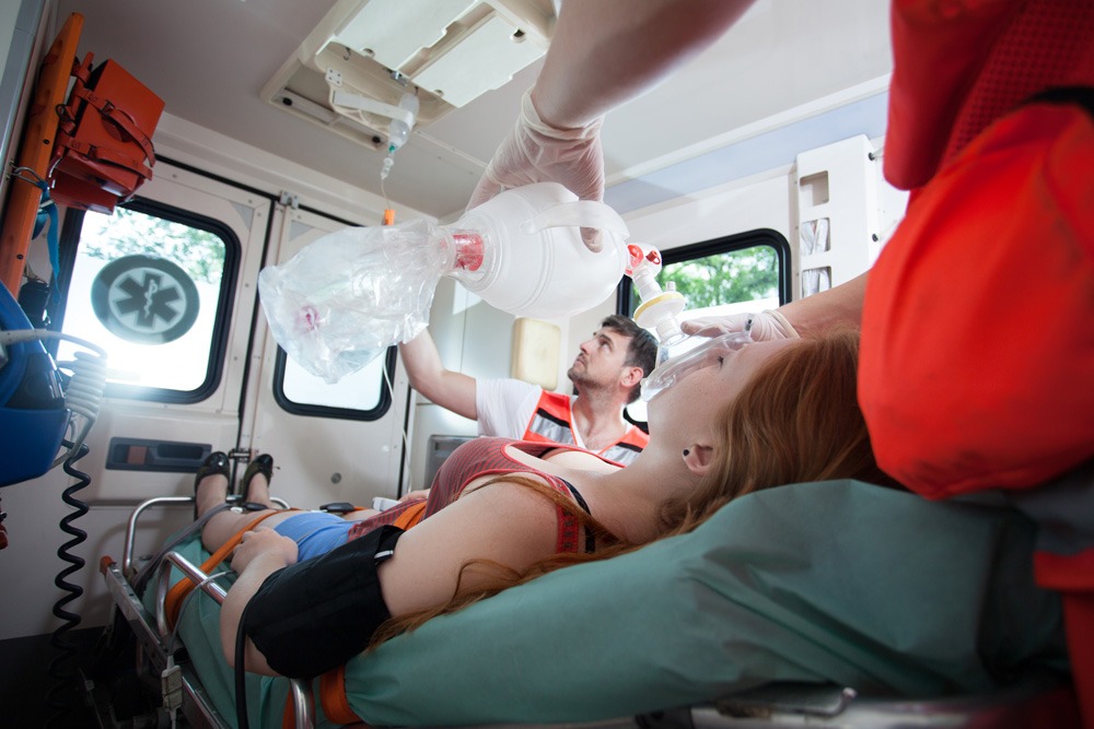 woman receiving emergency care in an ambulance