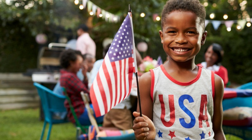 smiling child with American flag