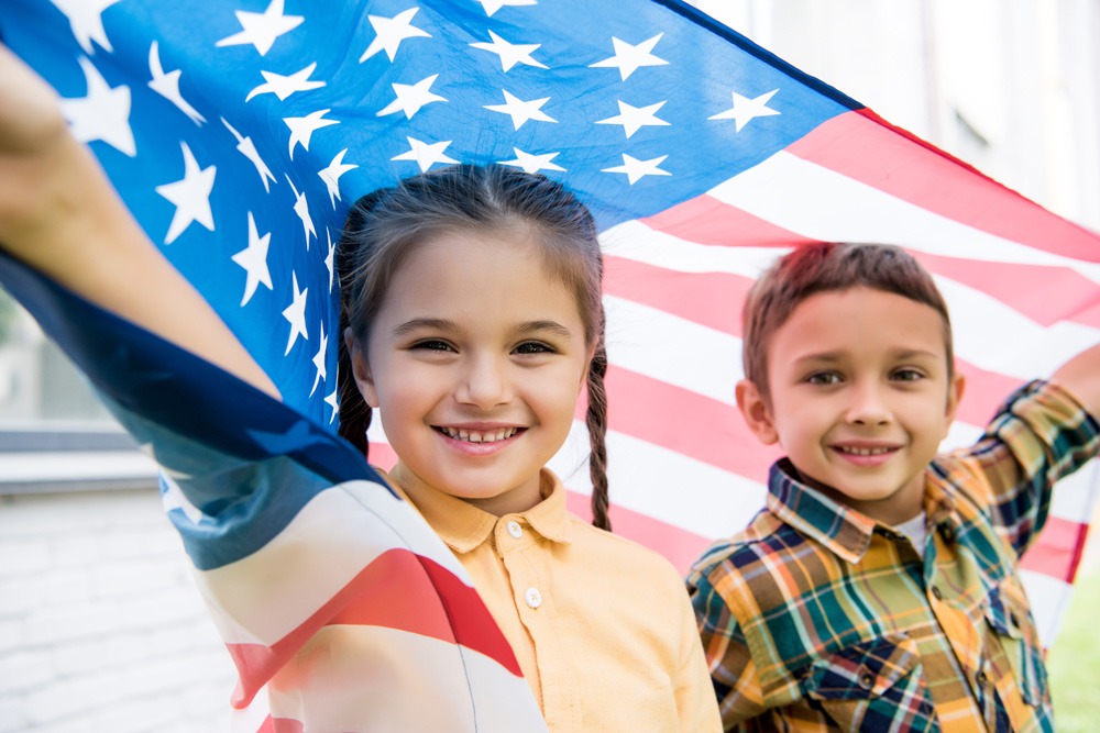 Children holding an American flag