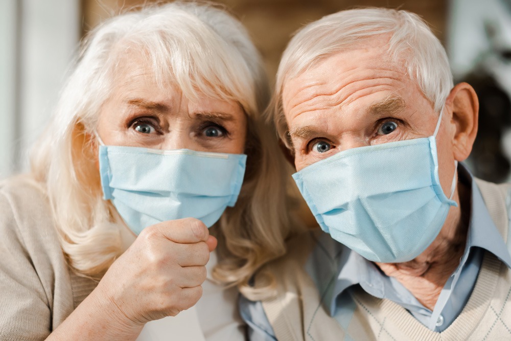 elderly couple wearing face mask