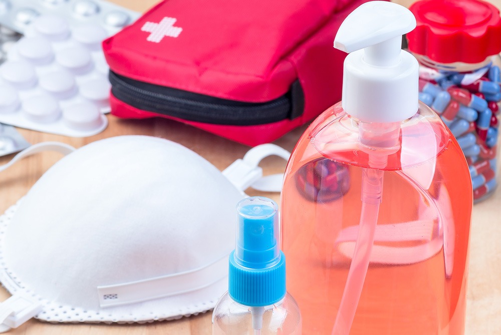 hand sanitizer, face mask, and a first aid kit