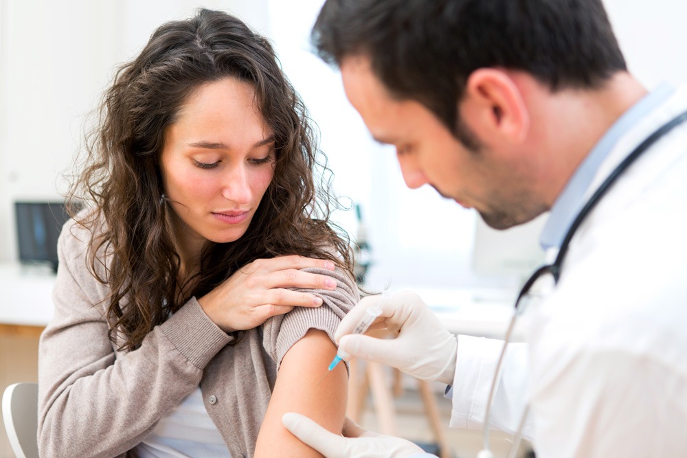 woman receiving flu shot