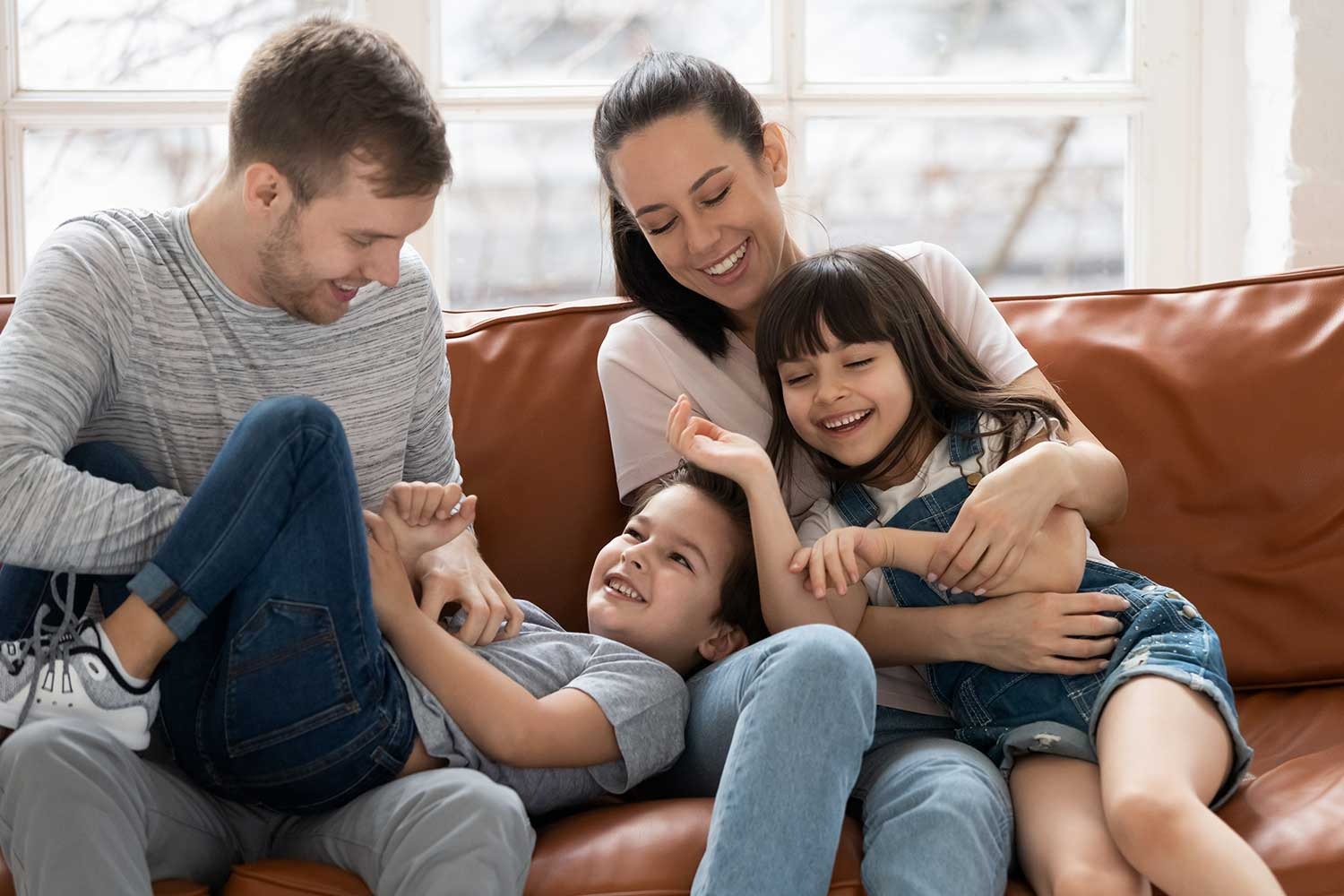 family playing on a couch