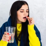 Woman taking antibiotics that may cause diarrhea symptoms