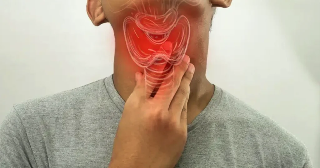 Person holding throat with highlighted graphic showing throat discomfort.